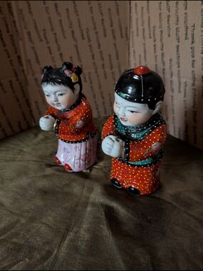 Red and Pink Ceramic Chinese Boy and Girl Figurines